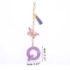 Unique Bargains Star Sequin Letter Q Butterfly Tassel Water Cup Pendant Purple 1 Pc